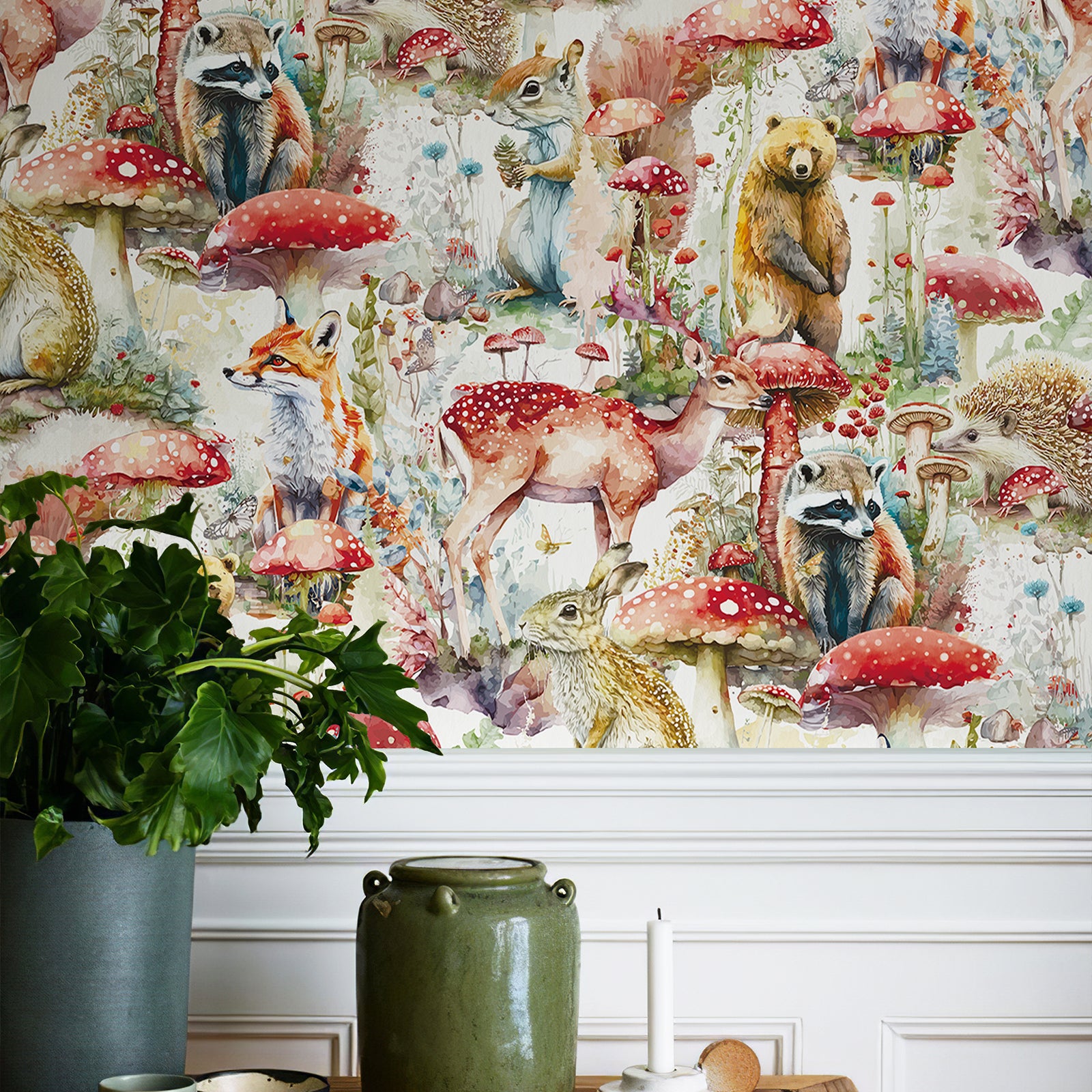 Woodland storybook wallpaper installed on the upper wall above white decorative wainscoting, matched with green pottery vase and foliage plant for elegant cottage‑style decor.